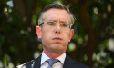 MP calls for Perrottet's head over costume