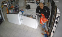 Man wearing Halloween mask robs store