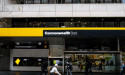 CBA lifts half-year profit but braces for slowdown