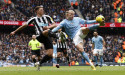 Soccer-Man City beat Newcastle 2-0 to maintain pressure on Arsenal