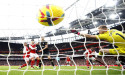  Soccer-Arsenal seal thrilling comeback win, Man City maintain chase 