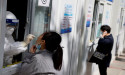 China plans random, spot checks at hospitals to track COVID