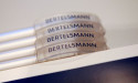  Bertelsmann posts record revenue, tops 20 billion euro target 