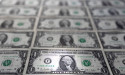  Dollar to log quarterly drop as rate hike bets recede 
