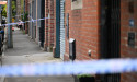 Son and friend in custody after mother stabbed to death