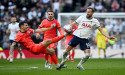  Soccer-Kane keeps Spurs top-four hopes ticking with winner against Brighton 