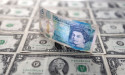 Sterling edges down ahead of busy data week for Britain