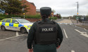 Man charged after crash close to Belfast police station 