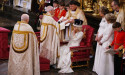  Archbishop spends several seconds adjusting crown for King during ceremony 