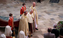 Crowned King switches into purple tunic and robes for Abbey finale