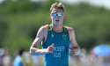 Hauser rallies from illness for second in triathlon.