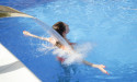 Enhancing Outdoor Living: The Multifaceted Benefits of Integrating Waterfalls into Pool Designs