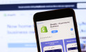 Why is Shopify moving its listing from NYSE to NASDAQ important for investors?