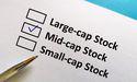  2 top TSX midcap stocks to buy for passive income QBR.B and TA 